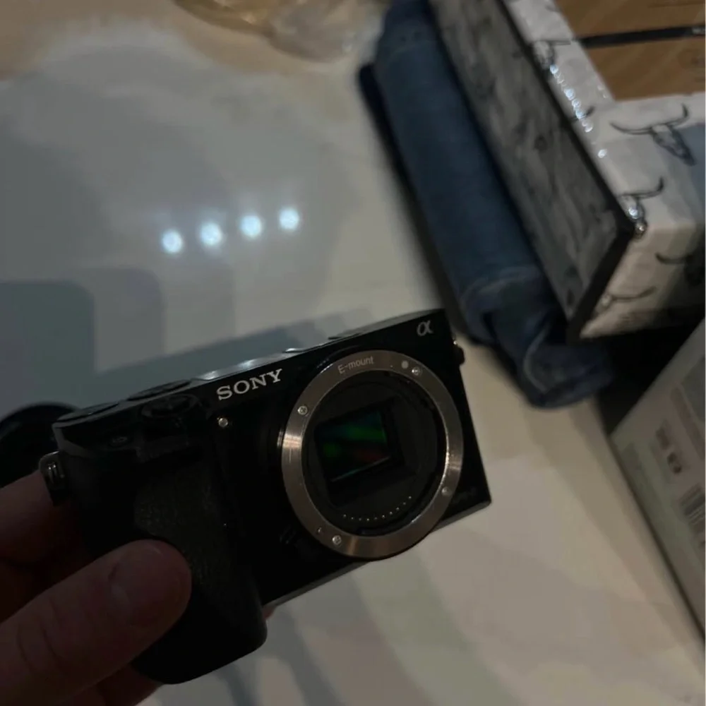Sony a6000 used with lens and battery and cable charger,bag the price is firm
